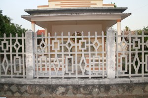 Graves in front of a house in Quới Sơn.