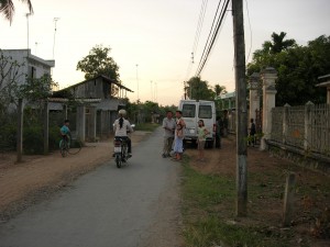 A road through a small town in the Mekong Delta.