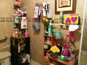 The ladies room in a Little Saigon restaurant  has fresh flowers and is stocked with personal grooming items like razors, facial wipes, deodorant, and make-up.